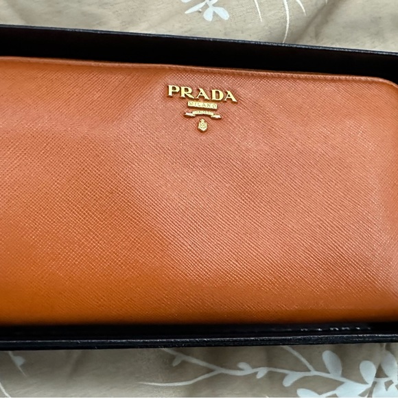 Prada orange long wallet with minor scuffs and tearing inside, in good condtion - Picture 1 of 11